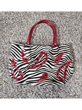 Cecconi Piero zebra print tote featuring red leather embellishments